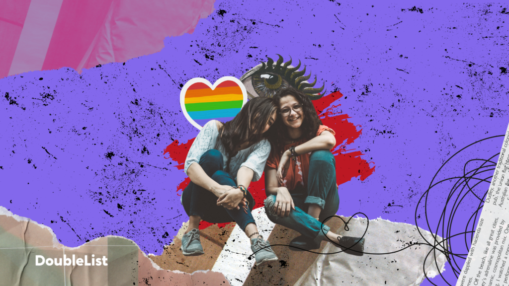 DoubleList graphic of a lesbian couple smiling and leaning on each other in front of a collaged background.